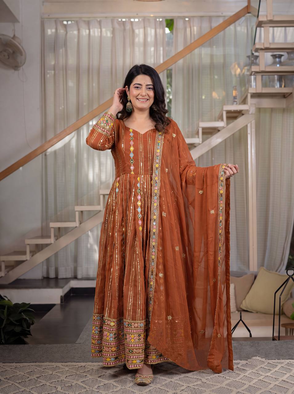 Radiant Rust Orange Flared Anarkali Suit Set Adorned with Multicolored Geometric Embroidery and Dazzling Mirror Work Detailing